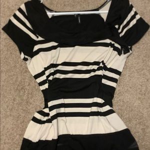 Black and tannish white shirt